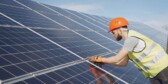 Young engineer checking maintenance of solar panels