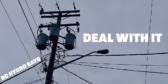 A closeup of a power pole with lots of wires and a street lamp on a cloudy day.