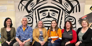 A group of representatives from BHP and North Island College sit together.