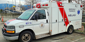 A British Columbia ambulance sits parked on a cloudy day. Is this the only ambulance in Port McNeill?