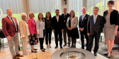 A group of Canadian and NATO leaders pose toggether for an official photo.