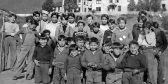 Indigenous children stand in front of the Christie Residential School on Meares Island.