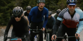 Riders from the Fernie Gravel Grind ride together up the road to Tahsis on a moody VanIsle day.