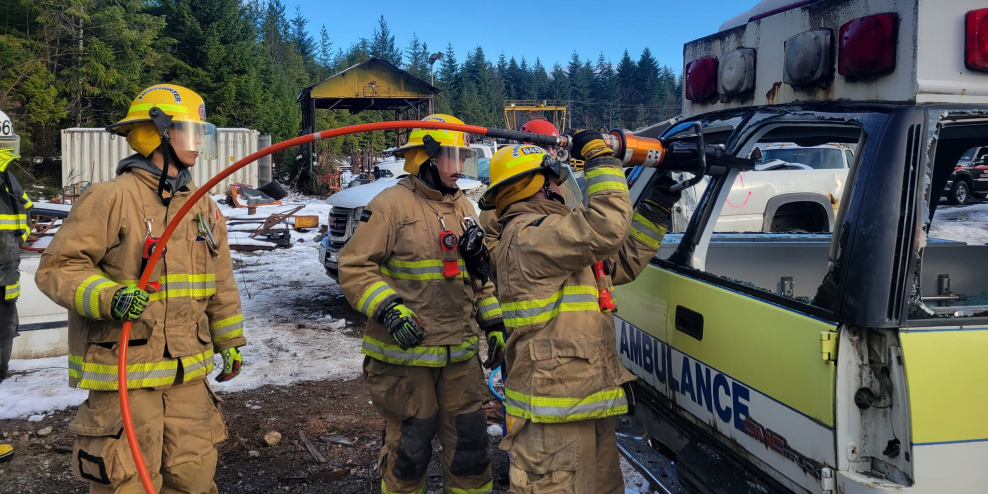 Volunteer firefighters learn how to extract someone from a damaged car.